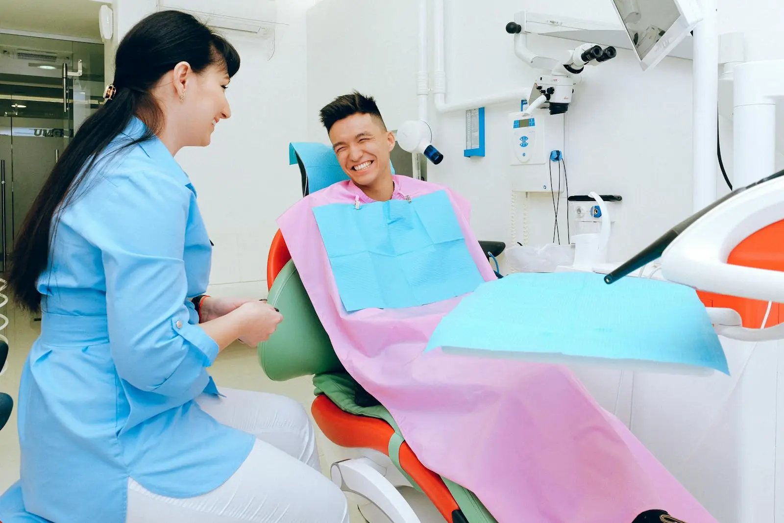 Smiling patient with a friendly dentist at Brightsmile Dental