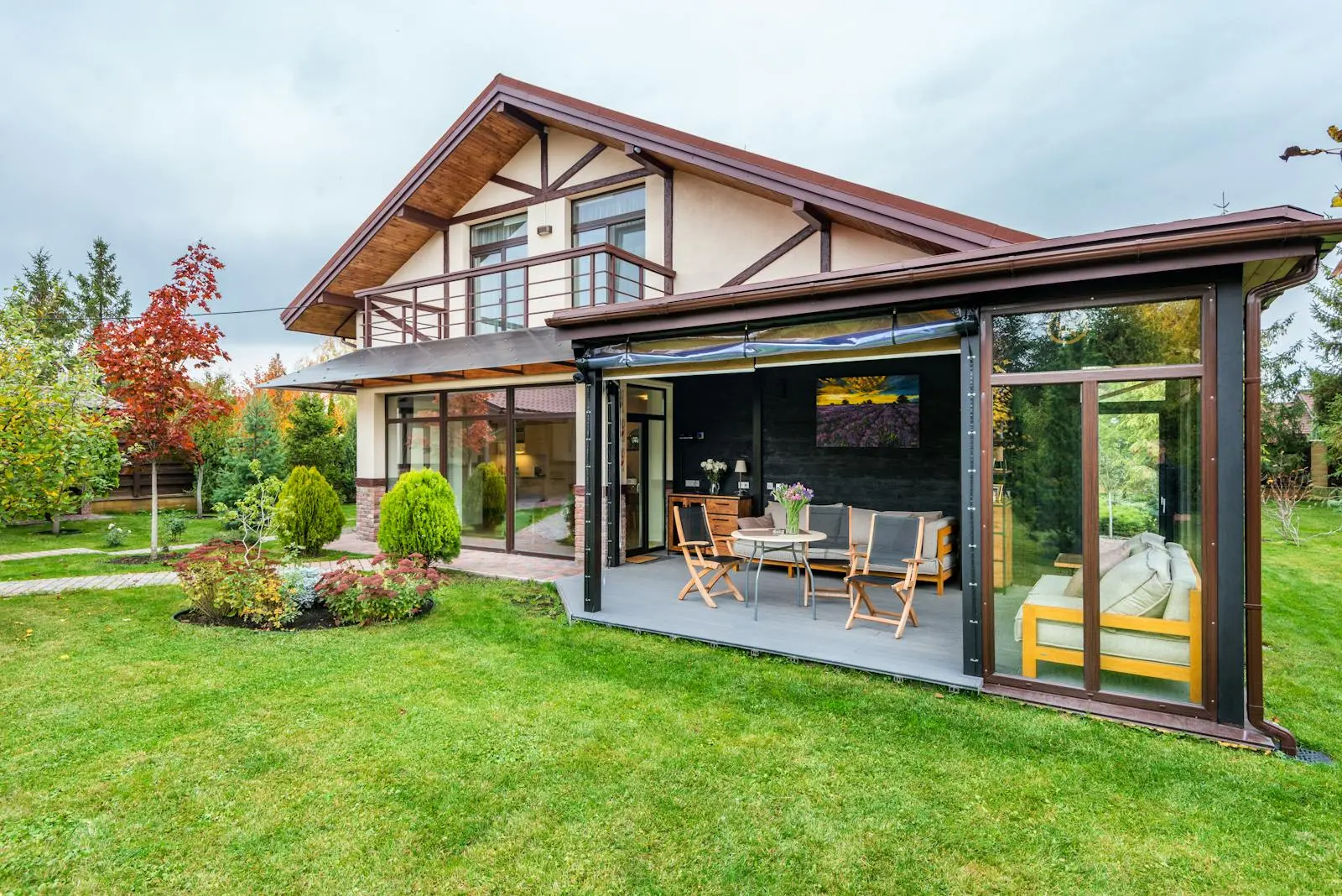 A freshly landscaped backyard with a manicured green lawn and covered patio in Portland