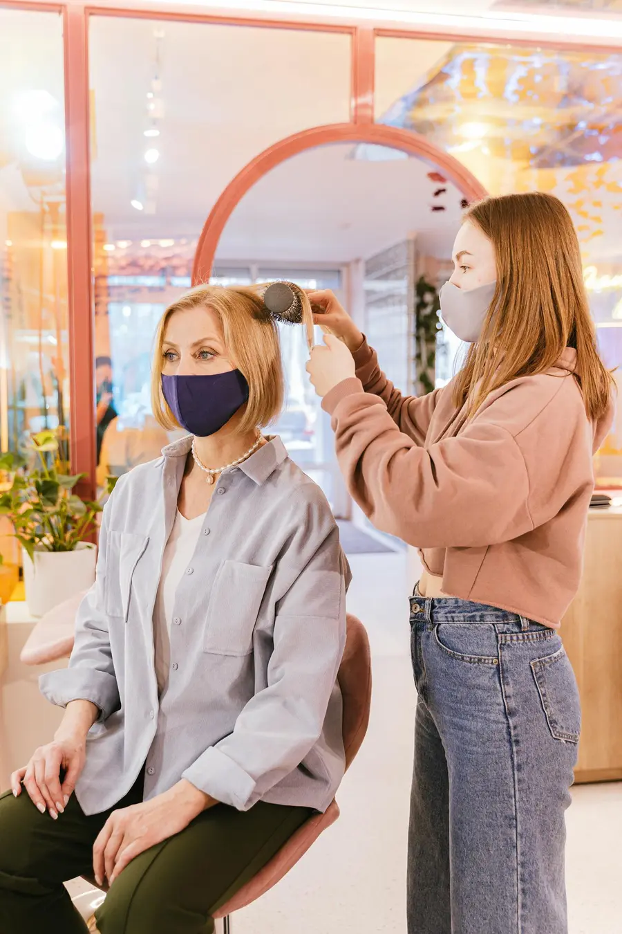A Lumière stylist finishing a client's blow-out