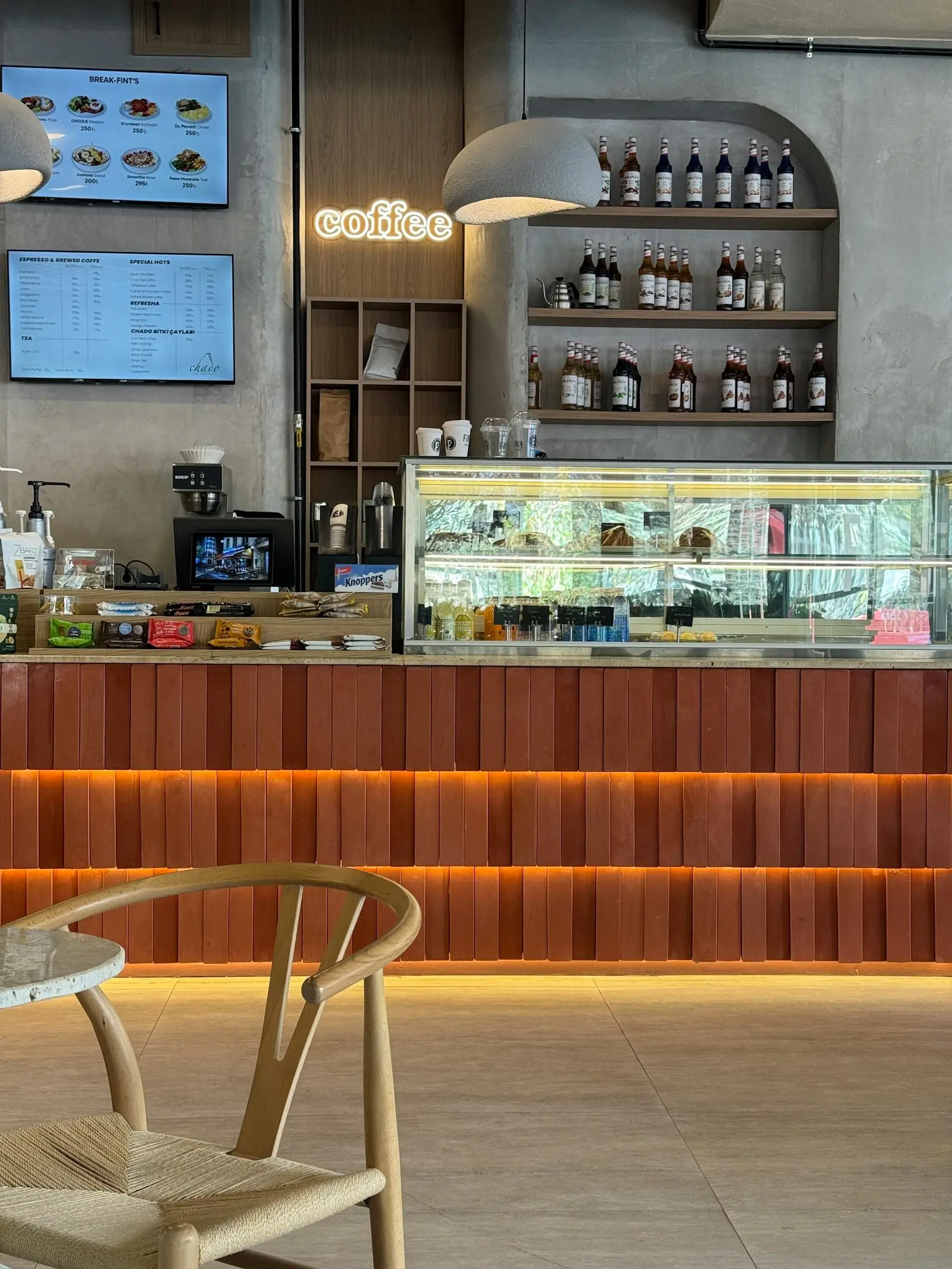 The warm wooden counter and pastry case inside River Bend Café