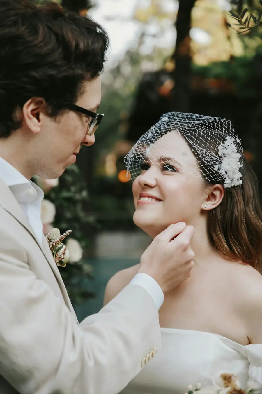 Wedding couple looking at each other outdoors