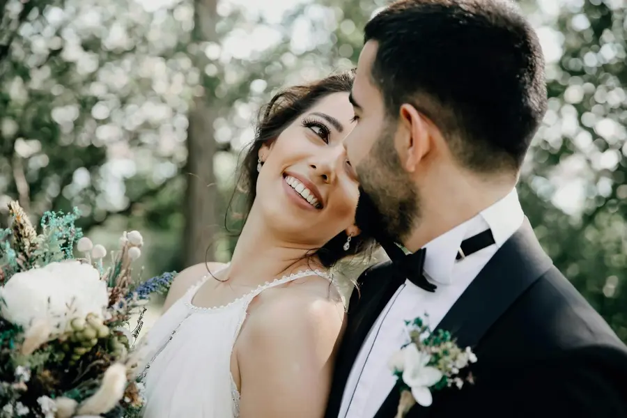 Close-up of a bride and groom looking at each other